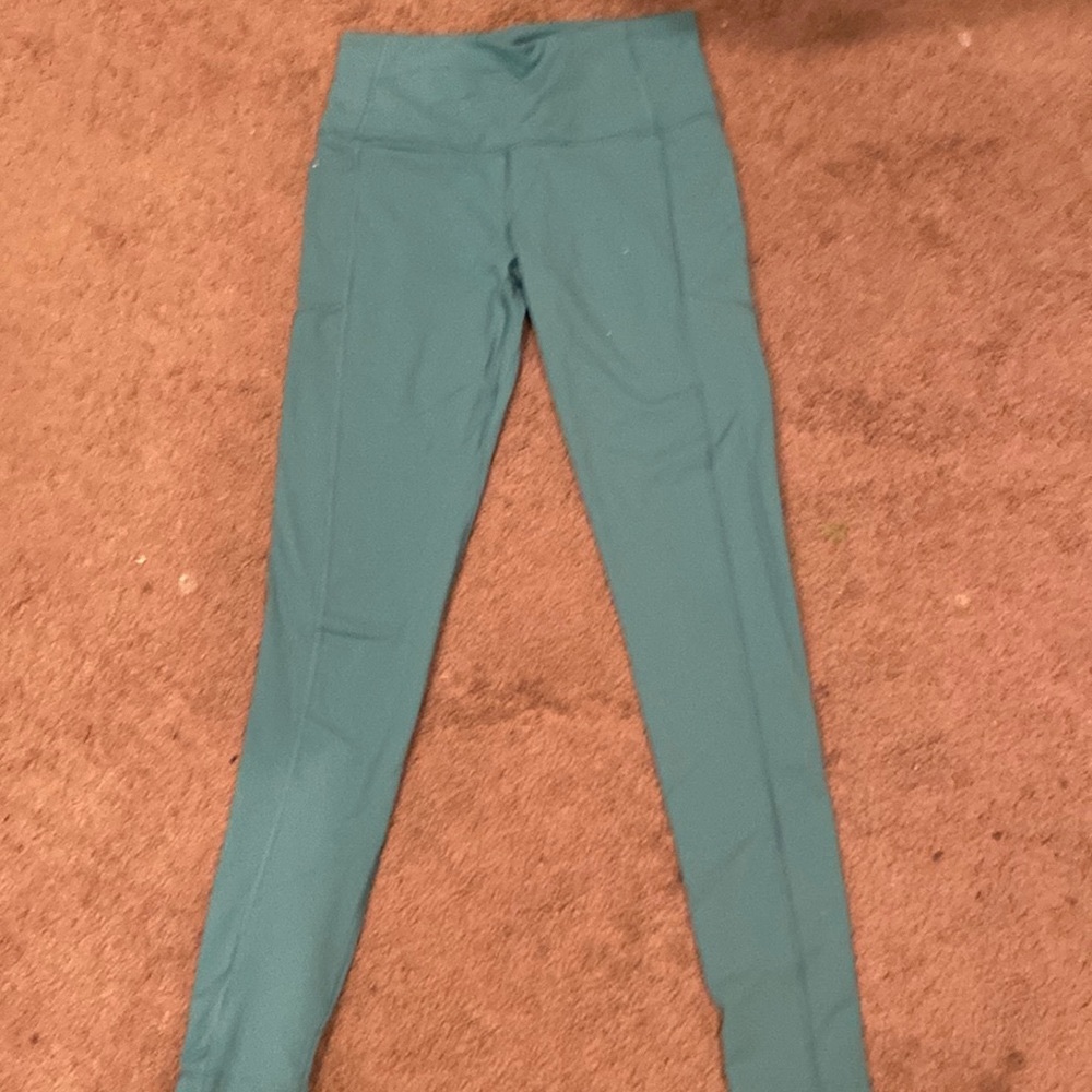Victoria’s Secret knock out high waisted workout leggings.  Light teal blue.